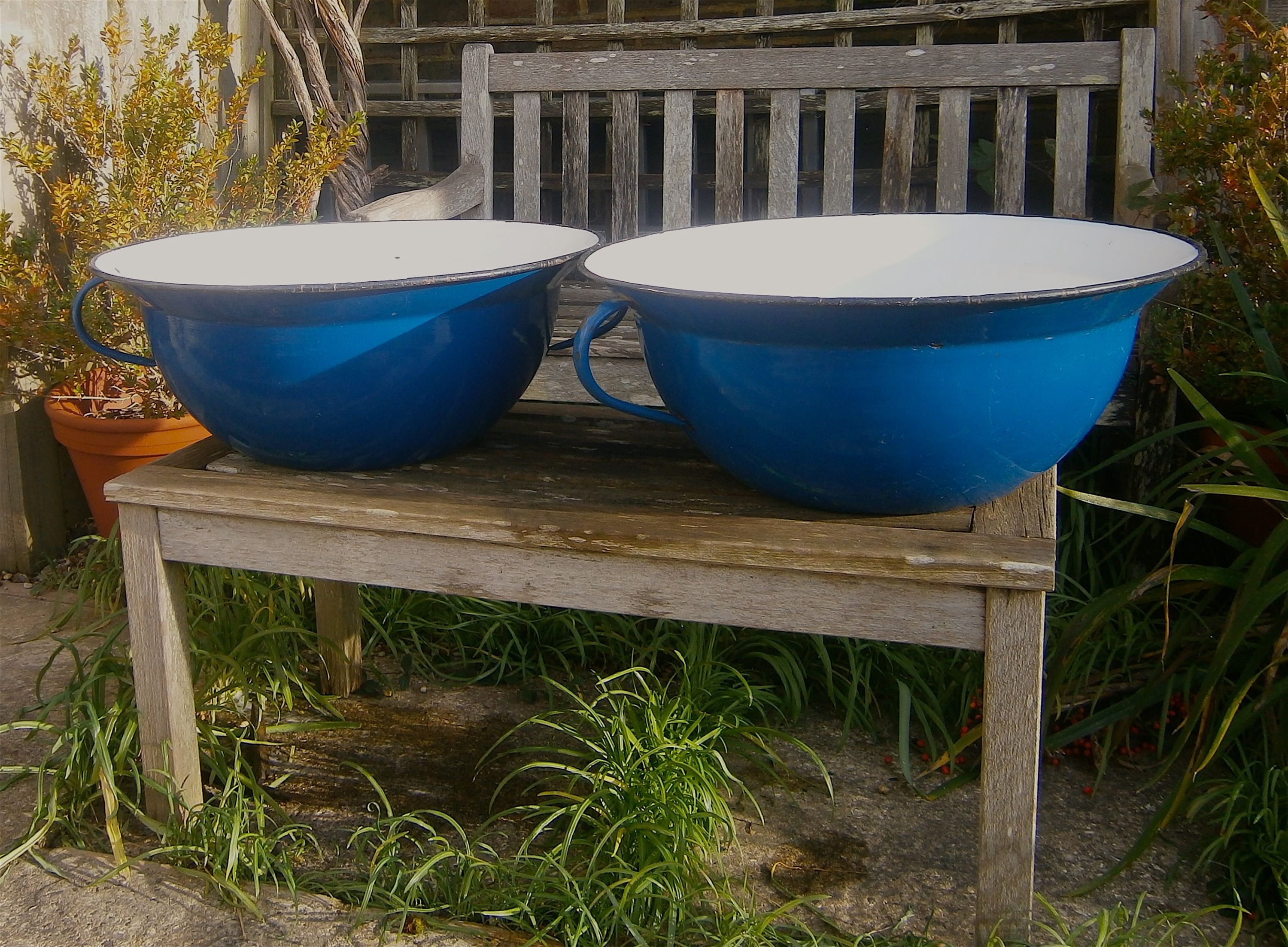 A pair of French enamel two-handled pans, 57cm diameter, 22cm high